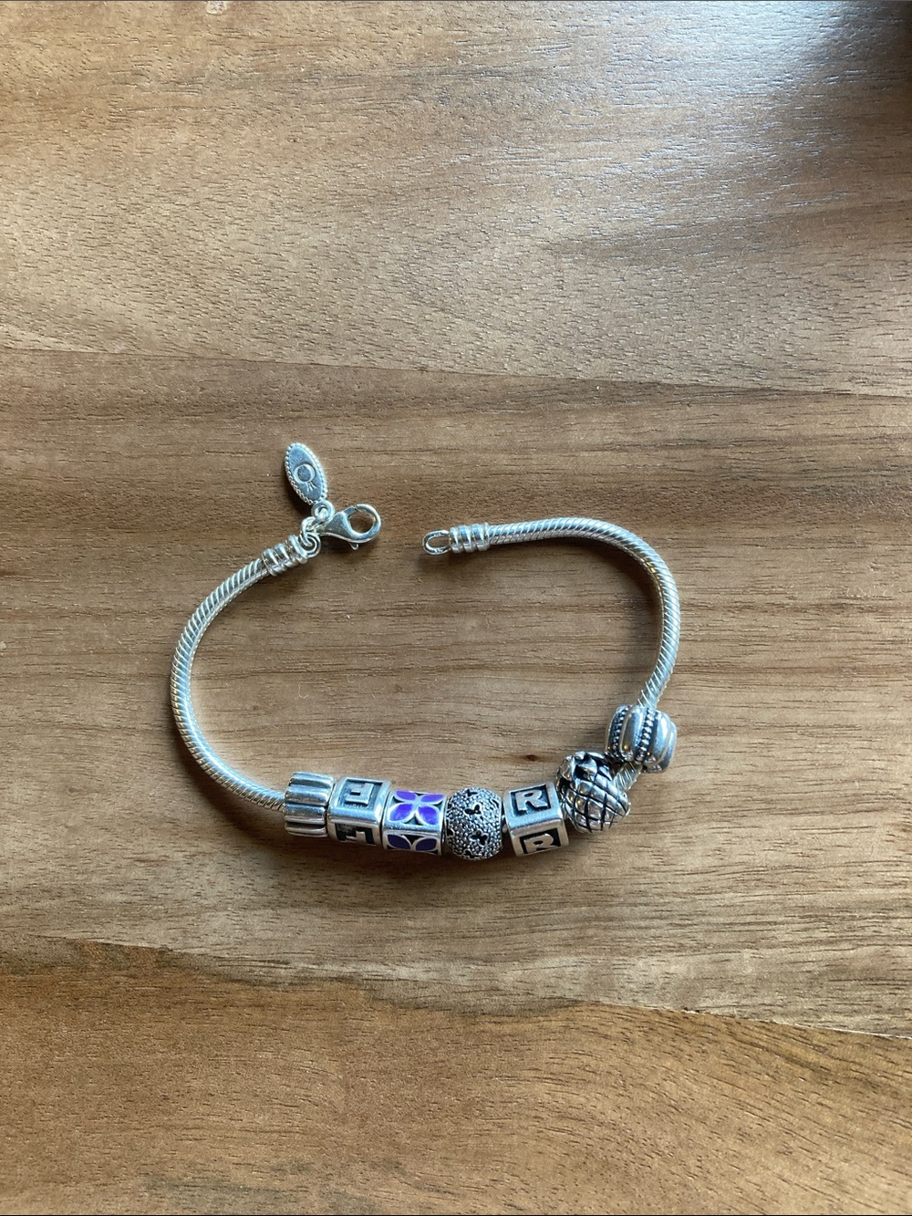 Pandora bracelet w/5 charms, 2 spacers.Minimal wear,like new.